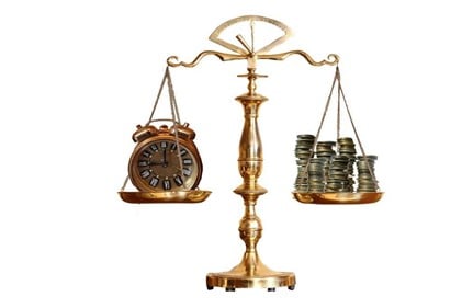 Clock and money on a balance scale.
