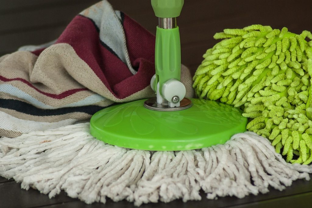 A mop and soft cloths for cleaning marble surfaces