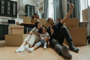  A family taking a picture while unpacking